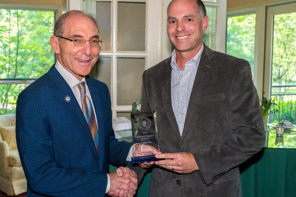 Professor accepting an award